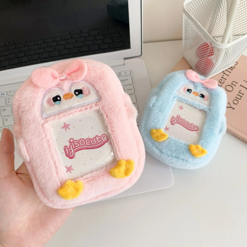 Two cute plush penguin pouches