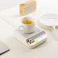 White Kawaii Panda Piano Cup Heater on a table 