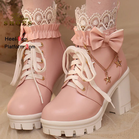 Pink boots with lace details and a bow on a beige background