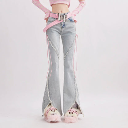 Person wearing light blue jeans with pink accents on a white background