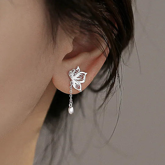 Kawaii Silver Butterfly Stud Earrings worn by a woman in blue