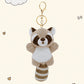 kawaii light grey raccoon plushie on a white background with small hearts
