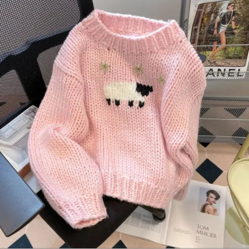 Front view of a Kawaii Little Lamb Sweater displayed on a chair