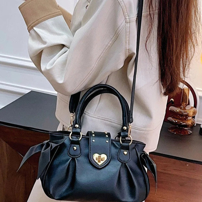 Kawaii Sweet Heart Lock Bag in black carried by a woman 