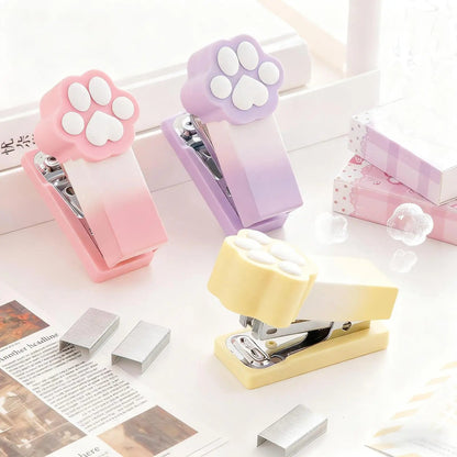 Kawaii Pastel Cat Paw Stapler, this image is showing the different colors you can get of the cat paw stapler which include pink, purple and yellow.