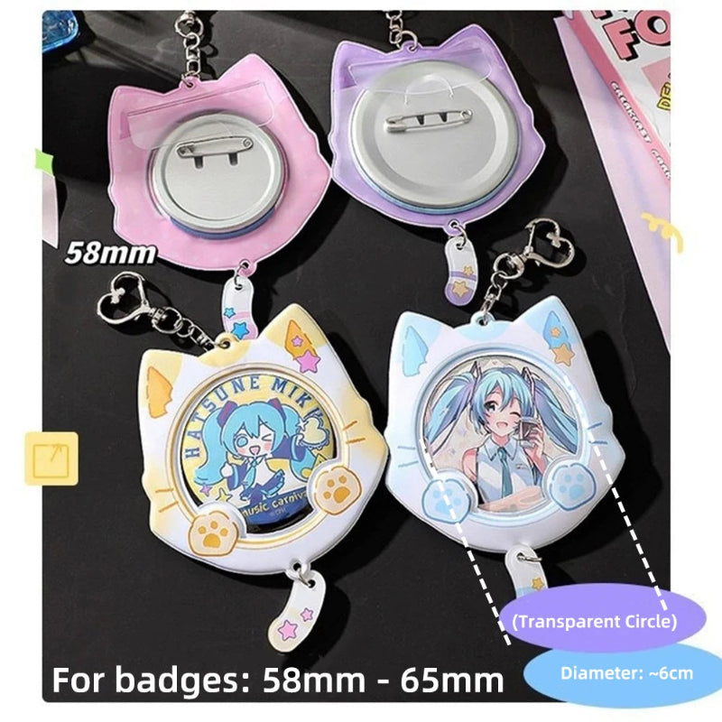 Four cat-shaped retractable badge reels with character designs, shown from both front and back views on a dark background. The reels feature pastel pink, purple, yellow, and white designs with anime character graphics.