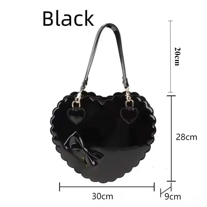 Black heart shaped handbag and measurements on a white background