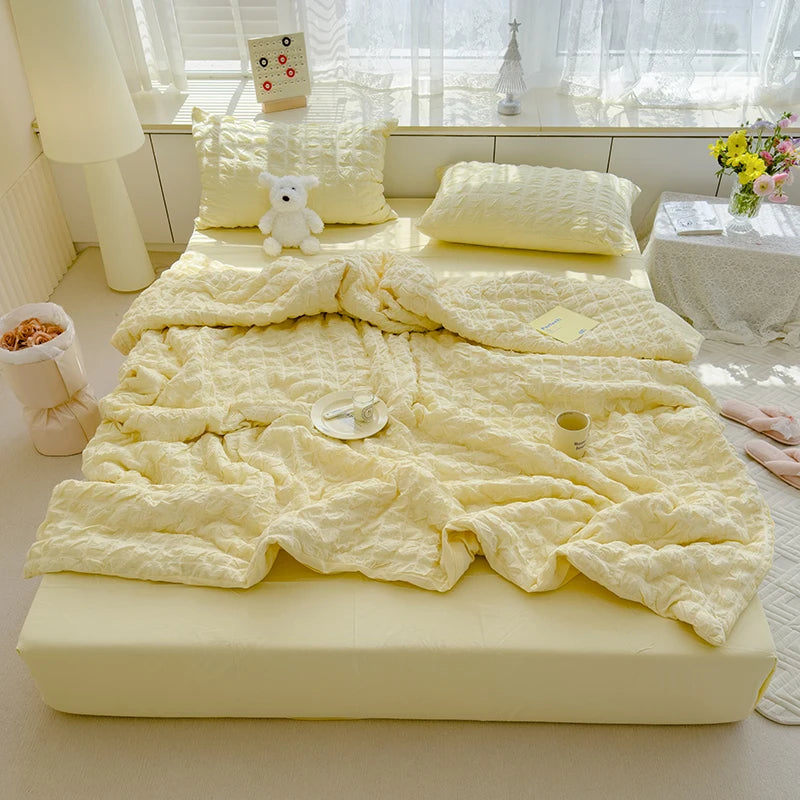 Yellow  seersucker duvet set displayed on bed.