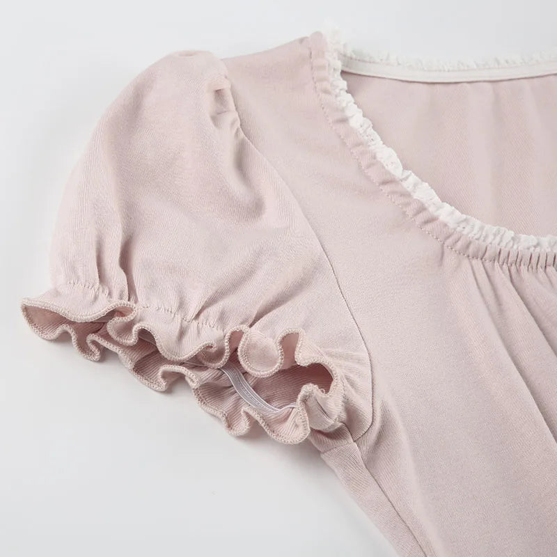 Pink short sleeved shirt on a light gray background