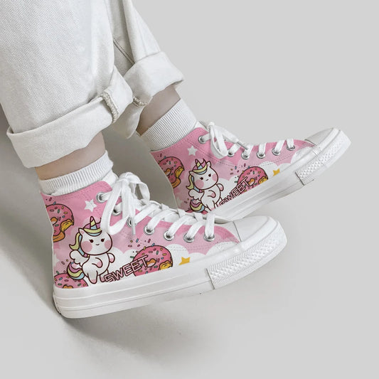Kawaii Pink and White Unicorn Canvas Sneakers shown with a woman modeling them 