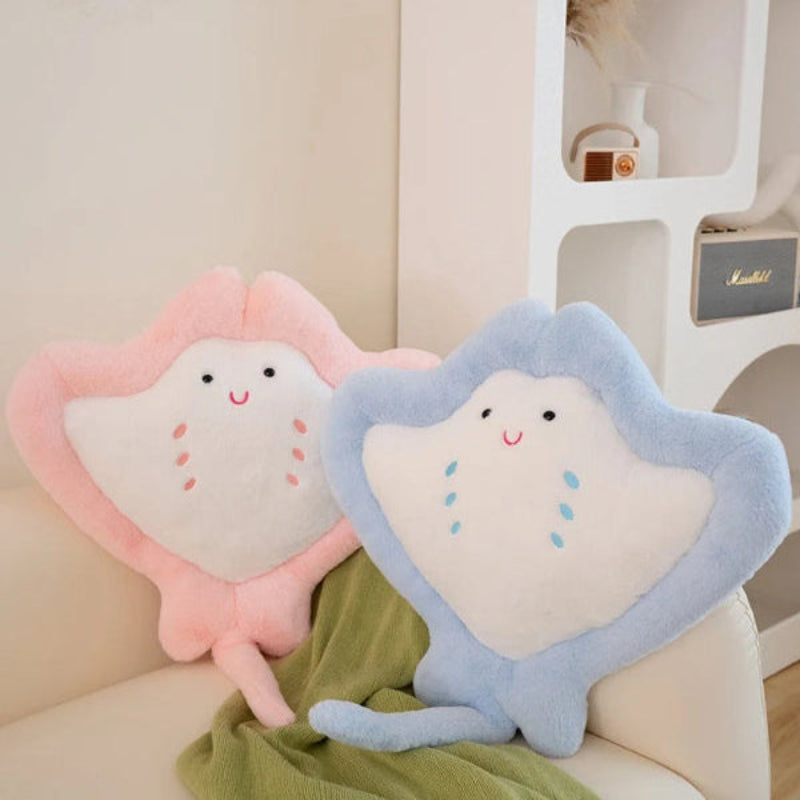 Kawaii manta ray plushie on couch