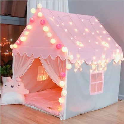 Pink children's play tent with string lights and a plush toy inside, set against a neutral background.