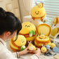 lady squishing one of nine kawaii bee plushies sitting on a desk.
