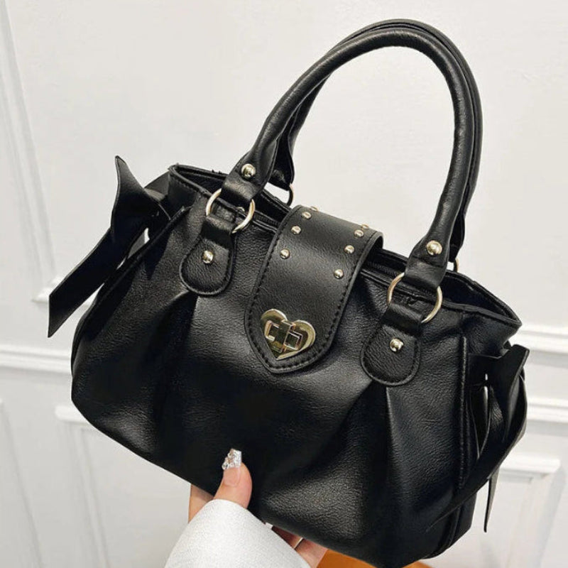 Kawaii Sweet Heart Lock Bag in black held by a woman
