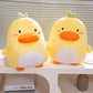 Kawaii Derpy Duck Plushies displayed together on an elevated white platform