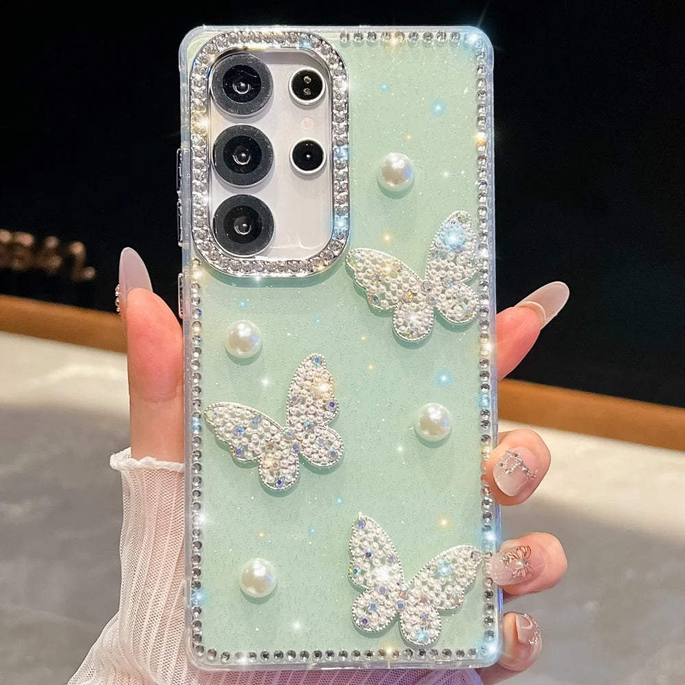 Phone case with butterfly and pearl designs held by a hand, mint green color