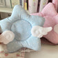 Star-shaped coaster with polka dots and cloud wings in blue and pink.