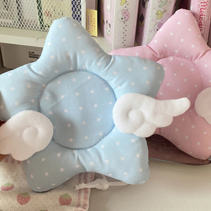 Star-shaped coaster with polka dots and cloud wings in blue and pink.