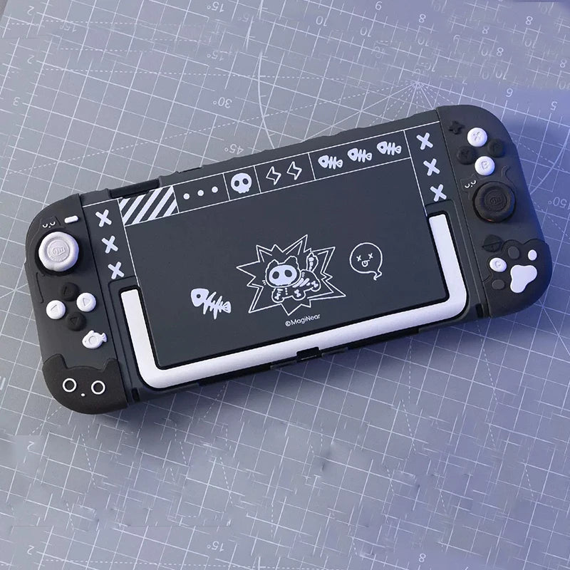 Handheld gaming console with stylized design on a grid surface