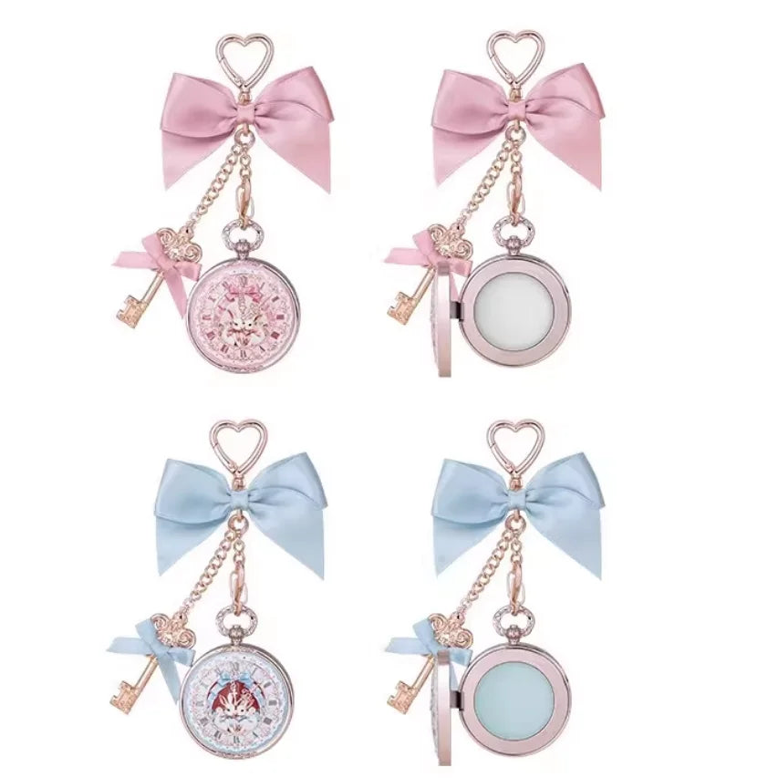 Four dlip balms with bows and key charms on a white background