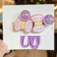 Set of colorful hair accessories on a white card with 'GG&MM' branding.