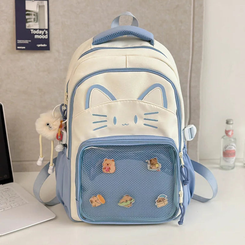 blue  neko backpack displayed by a white wall