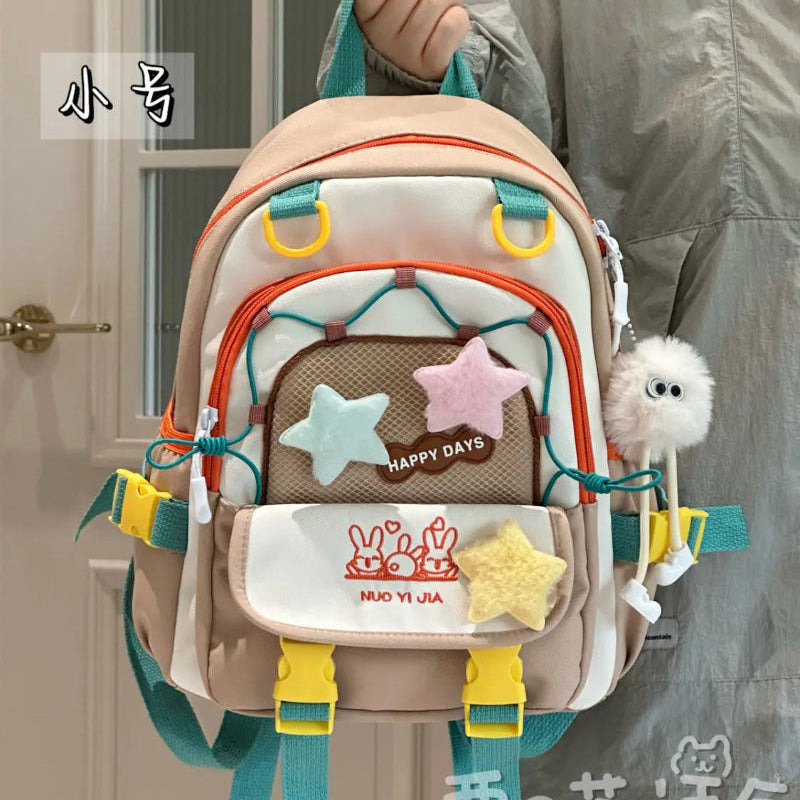 Kawaii backpack with multiple pockets being held by a person