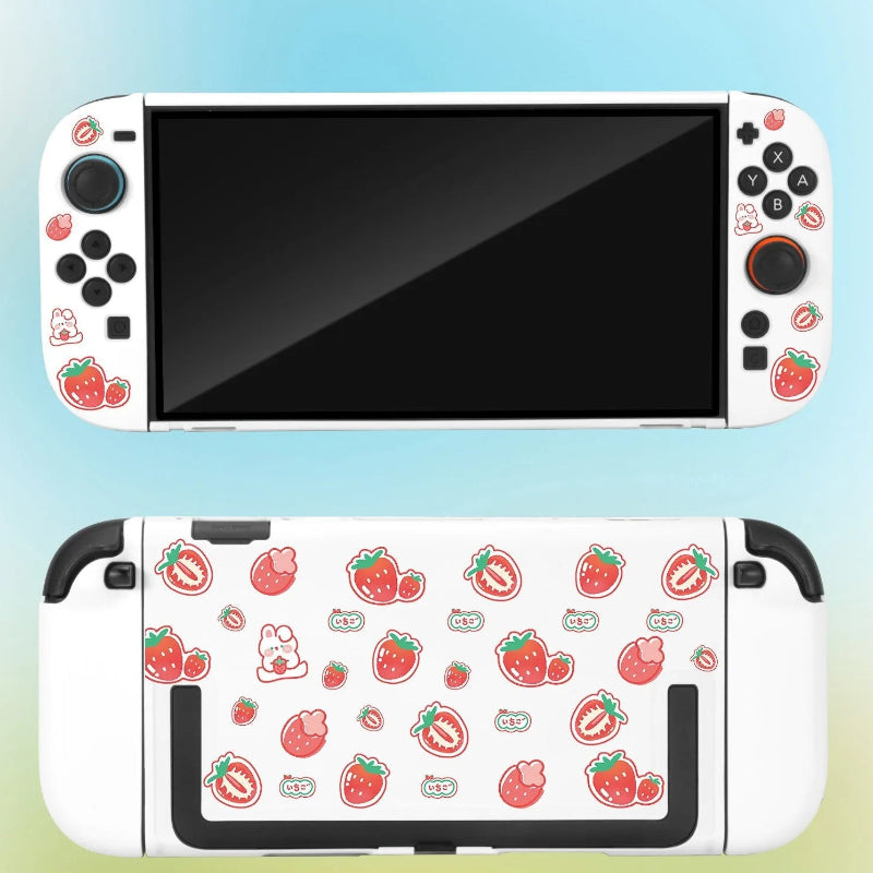 Gaming console with strawberry patterned cover on a gradient background
