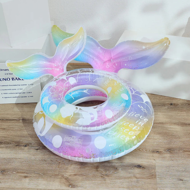 Inflatable ring with mermaid tail design on a wooden surface
