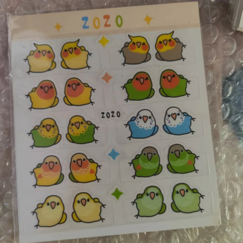 Sheet of stickers with cartoon birds on a clear background.