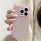 Pink phone case with star designs held by a person against a neutral background