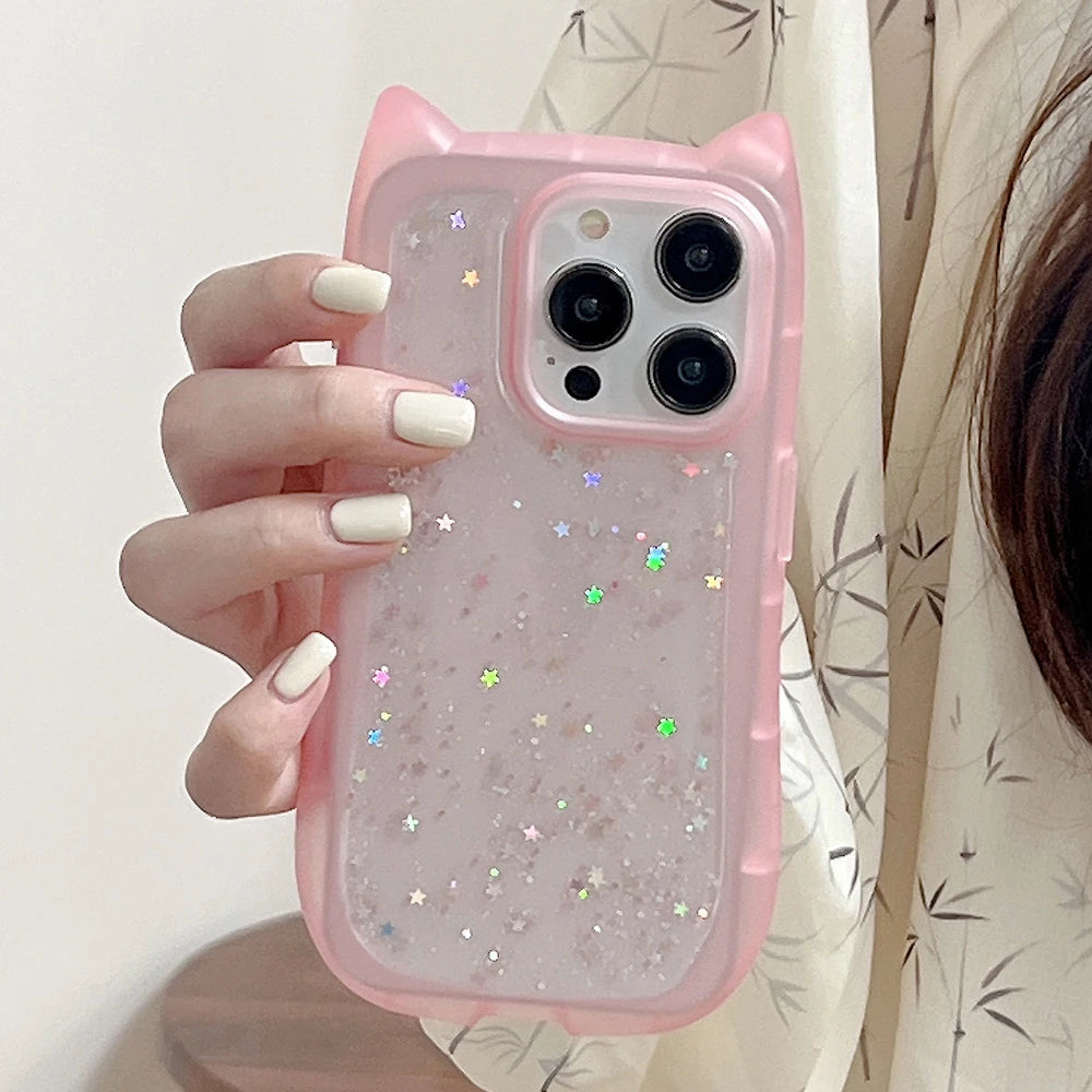 Pink phone case with star designs held by a person against a neutral background