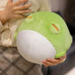 Woman holding Kawaii green and white plushie