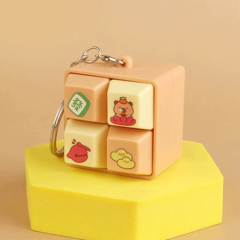 Cute keychain with cartoon designs on a beige background