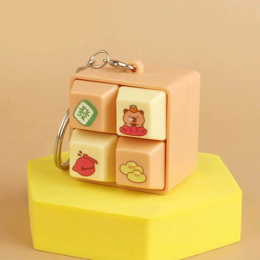 Cute keychain with cartoon designs on a beige background