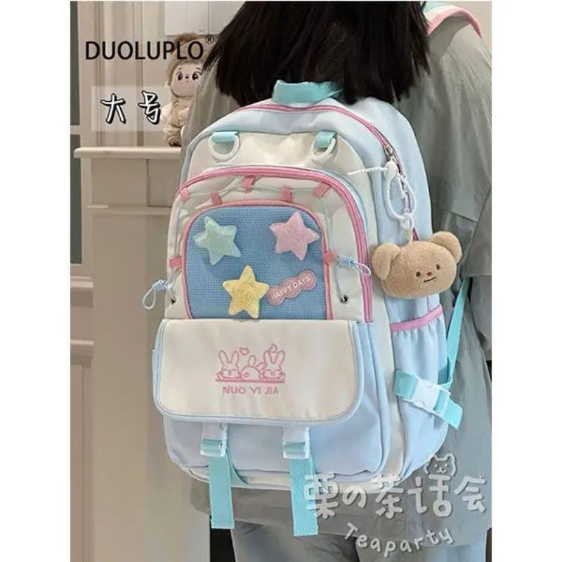 Kawaii backpack with star designs being worn by a person