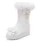 White snow boot with decorative bows on a white background