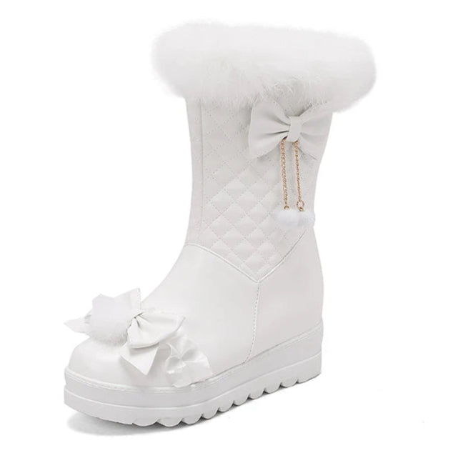 White snow boot with decorative bows on a white background