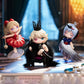 Three animated character figurines on a stage with spotlights