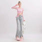 Person wearing a pink top and cute jeans