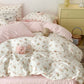 Kawaii floral bedding set on a bed with a nightstand in the background