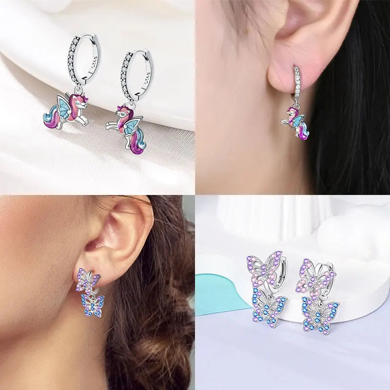 Unicorn-shaped earrings displayed on a white background and worn by a person.