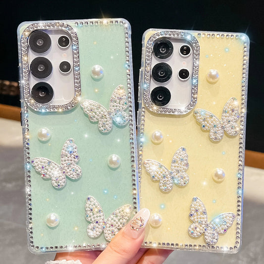 Two phone cases with butterfly and pearl designs one in mint green and the other in a pastel yellow color held by a hand.