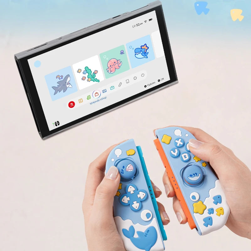 Two colorful gaming controllers held by hands with a screen displaying game graphics in the background.
