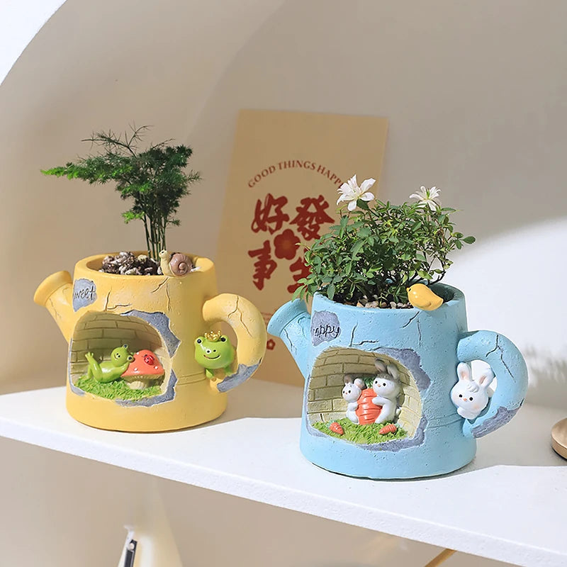 Two decorative teapots with animal-themed designs on a white surface.