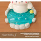 Cute resin figurine of a cat in a onsen with a yellow towel on its head on a wooden surface.