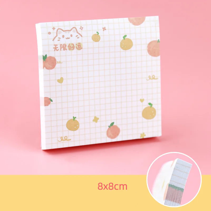 Kawaii sticky notes pad with peach pattern on a pink background