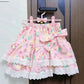 Pink skirt with floral pattern and bow on a hanger against a wooden door.