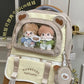 beary cute backpack with bear ears and a visible brand logo , white door as a background , brown version