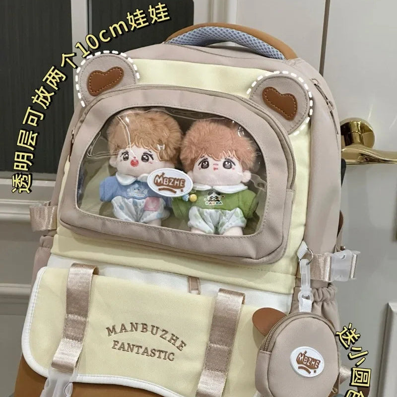 beary cute backpack with bear ears and a visible brand logo , white door as a background , brown version